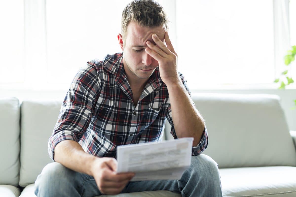 A man looking stressed about going to trial.