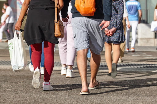 Pedestrians walking across the street.